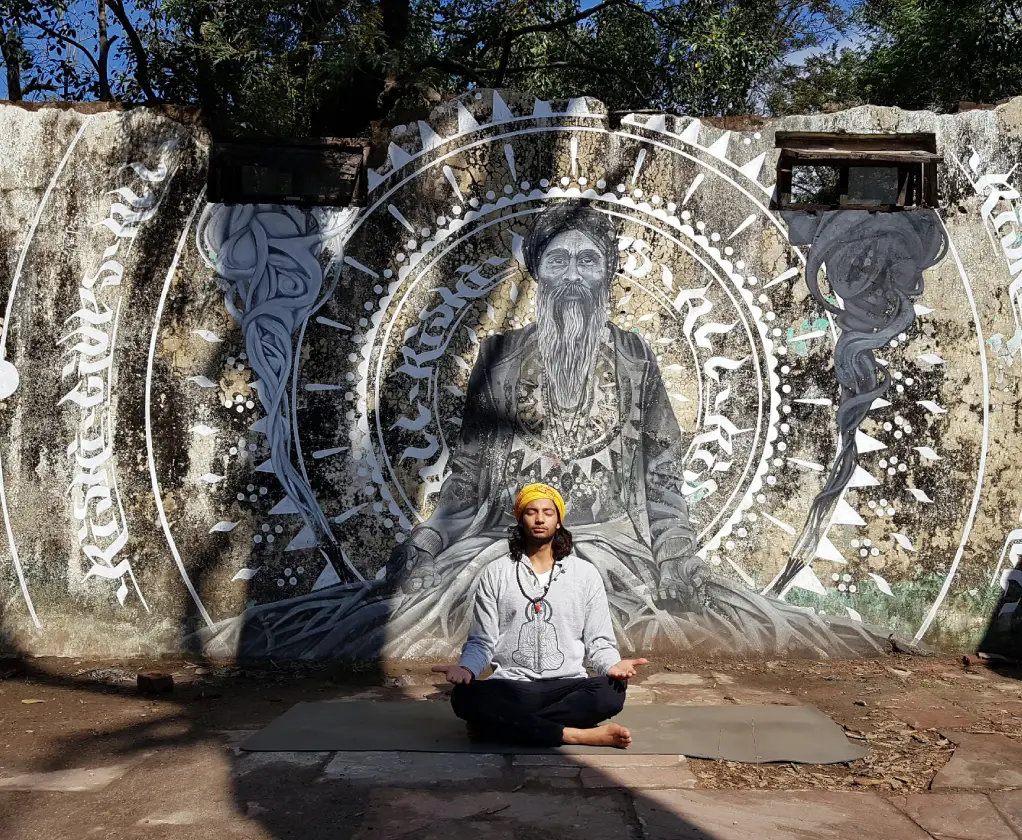 A yoga student sitting upright and focusing on the breath