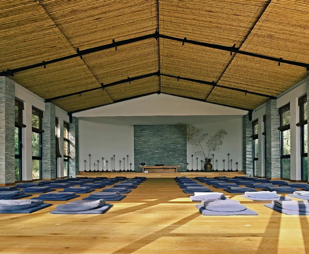 A calm and uncluttered space prepared for yoga practice
