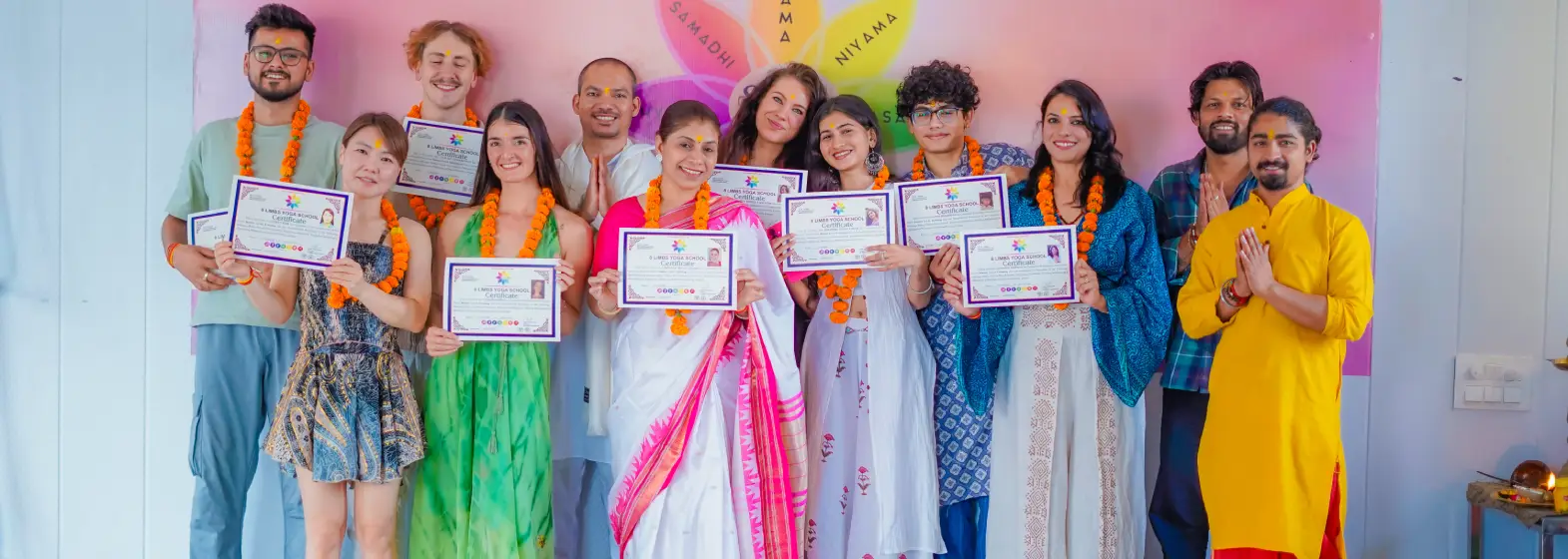Students practising yoga during teacher training at 8 Limbs Yoga School